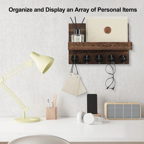 Wall Mounted Key And Mail Organizer With Shelf And Large Hooks For Keys Bags Coats And Leashes Keeps Your Essentials In One Spot Paulownia Wood Key Hanger With Mounting Hardware Brown Finish Durable Entryway Organizer mounted on a wall above a desk with items on shelf.
