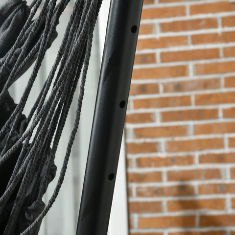 Close-up of dark gray weatherproof fabric and boho tassels on Patio Hammock Chair With Stand For Outdoor Chill And Cozy Lounging