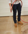 Person using Heavy Duty Three Quarter Inch Water Hose 100 Foot, Workhorse Rubber and Vinyl, Kink Resistant, Rugged Red Cover, 400 PSI Burst Strength