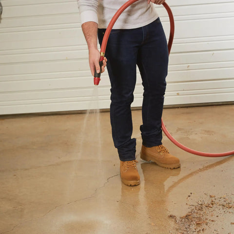 Person using Heavy Duty Three Quarter Inch Water Hose 100 Foot, Workhorse Rubber and Vinyl, Kink Resistant, Rugged Red Cover, 400 PSI Burst Strength