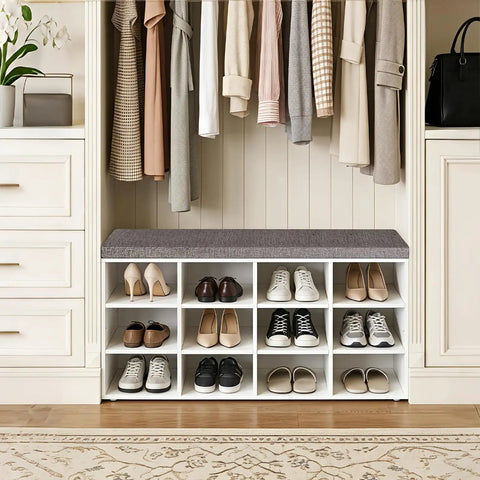 12 Cubby Shoe Storage Bench With Cushioned Seat And Adjustable Shelves White Entryway Organizer in closet with shoes and clothes.