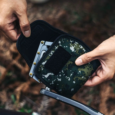Person using Neoprene Bike Pedal Covers for Transport and Storage, 3mm Thick Cushioned Protection in Green Camouflage design.