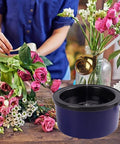 Top Shelf Premium Hot Melt Glue Pellets One Pound Pack used for floral arrangements, pouring liquid glue from a gold spoon.