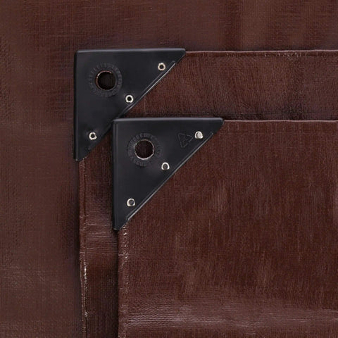 Corner detail of a Beastly Heavy Duty 18x24 Foot 16 Mil Poly Tarp Waterproof UV Resistant with rust proof grommets.