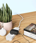 12V 2A AC Power Adapter Replacement For CS-1202000 Wall Charger with blue tip connectors plugged into a power strip on wooden table