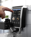 Dinamica Plus Fully Automatic Espresso Machine With Built In Grinder And Auto Milk Frother, touchscreen display in use.