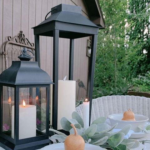 Large Outdoor Solar Powered Lantern With Open Frame No Glass Black Metal 19 Inch Tall Dusk To Dawn Timer Flickering LED Candle Lantern For Porch Patio Garden Rustic Farmhouse Vibe on outdoor table