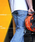 Person holding Heavy Duty Metal Extension Cord Reel Stand For 100 Ft 14 3 Cords with rugged black base and smooth handle.