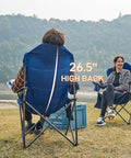Two Pack Oversized Folding Camping Chair Set With High Back Padded Comfort Grab And Go Style Lightweight Steel Frame Portable Lawn Chairs For Outdoor Use Easy Fold Sturdy And Durable For Adults Grey, shown with two people seated by a lake.