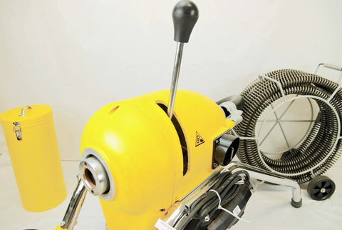 Real Deal Sectional Sewer Snake Machine 1.5 HP Drain Cleaner with 120 Foot Cable and Six Piece Cutter Set from an angle highlighting motor and handle.