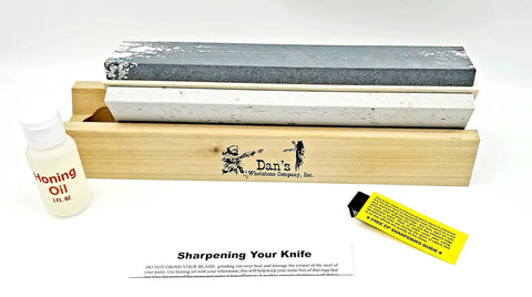 All In One 3 Stone Knife Sharpening System With 10 Inch Silicon Carbide Coarse Stone, Soft Medium And Hard Arkansas Novaculite Whetstones, Free Honing Oil, 23 Degree Angle Guide, Made In USA displayed on wooden base.