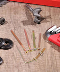 Forty Nine Piece M6 Hex Drive Screws And Barrel Nuts Set For Furniture Repair And Bed Frame Connections with tools on wood surface
