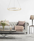 Cool Gold Ring LED Chandelier Pendant Light Minimalist Halo Ring Fixture over modern living room sofa setting.