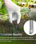 Hand placing 50 Pack 4-Inch Galvanized U Shaped Landscape Staples Garden Stakes For Lawn Landscaping Ground Stakes Weed Barrier Fabric Tent Stakes Outdoor Decor And Christmas Display 11 Gauge Rust Resistant Steel in soil
