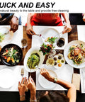 People dining at a table with various dishes including salad and pasta, focusing on table settings, hands, and food presentation.