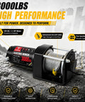 Zehuax 3000LBS 12V DC Electric Winch With Waterproof Steel Cable And Wired Remote Control For ATV UTV Vehicle Recovery on rocky ground.