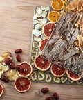 Dried fruit and jerky arranged on trays from Six Layer Stainless Steel Food Dehydrator And Fruit Dryer Machine.