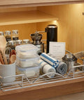Heavy Duty Pull Out Cabinet Organizer With Smooth Sliding Drawers In Chrome Finish For Easy Access To Spices Pots And Bakeware Fits 23.25 Inch Cabinets And A 22 By 17 Inch Basket No Brainer Install holding kitchen items inside cabinet
