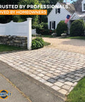 Driveway using Easy To Use Polymeric Sand Alternative For Pavers And Flagstones, Haze Free Joint Filler, next to white fence.