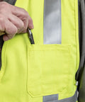 Close-up of pocket on Hi Vis Deluxe FR Road Vest Type R Class 2 Small Dual Certified For Flash Fire And Arc Hazard, inserting pen.