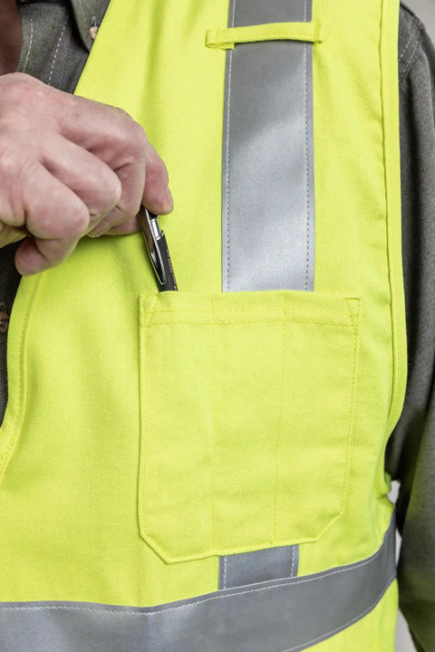 Close-up of pocket on Hi Vis Deluxe FR Road Vest Type R Class 2 Small Dual Certified For Flash Fire And Arc Hazard, inserting pen.
