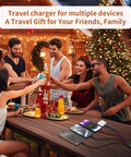 A group celebrating with Go-To All In One Dual Type C Charging Cable 4 In 1, placed on festive table, ideal for travel and charging.