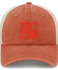 Front view of Dope Trucker Hat For Women And Girls Saffron Washed Distressed Low Profile Cap with red text, adjustable buckle