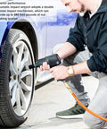 Pneumatic Air Impact Wrench With Half Inch Drive Dropping 720 Nm Of Kickass Torque At 7800 Rpm being used by a mechanic on a car tire.