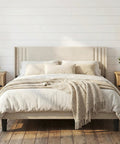 Prime Queen Bed Frame With Plush Wingback Headboard And Heavy Duty Steel Base For Ultimate Lounge Comfort And Durable Support To Kick Back And Rock Your Bedroom Setup in a cozy setting.