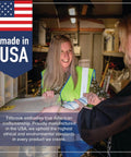 Two people smiling in a workshop with 'Made in USA' sign, emphasizing American craftsmanship and environmental standards.