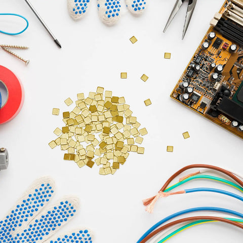 150 pieces gold plated copper solder chips for jewelry making and electronics repair with tools and circuit board nearby
