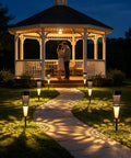 Solar Torch Lights Outdoor With Flickering Flame For Pathways And Garden Waterproof Landscape Lighting illuminating a pathway at night