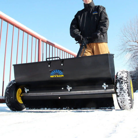 Spyker P70-12010 Commercial Drop Spreader With 120 Lb Hopper, 36 Inch Spread Width, Powder Coated Steel Frame in use on snow
