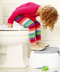 The Real Deal Toddler Potty Training Chair 3-In-1 Potty Seat With Step Stool Plus Arm And Hammer Deodorizing Disc Gray Removable Bowl Makes Cleanup A Breeze Latex Free For Kiddos, child using gray potty chair.