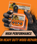 All Purpose Wood Filler Repair Kit With Putty Knife And Sanding Block for DIY Home Projects packaging held by a gorilla hand.