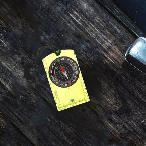 Orienteering Compass High Precision Acrylic Navigation Tool for Survival and Camping on dark wooden surface