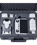 Waterproof Hard Case For DJI Mini 4 Pro Mini 3 Pro And RC Transmitters RC 2 RC N2 N1 Holds Up To Seven Batteries And RC Lanyard With Custom Foam Padding Case Only, showing interior with organized drone gear and custom foam padding.