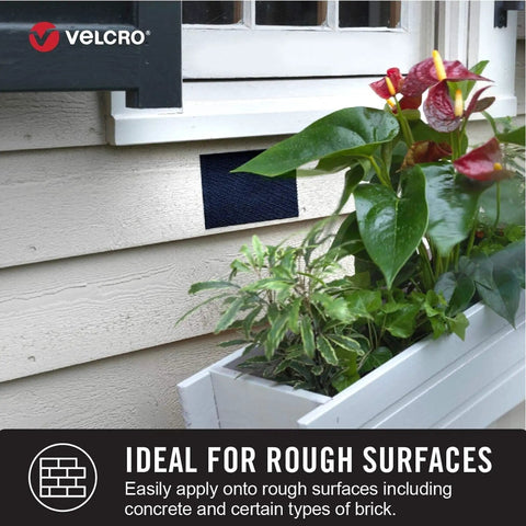 Beefy Extreme Outdoor Heavy Duty Tape With Stick On Adhesive, 10 Ft By 1 In, attached to siding near a window and plants