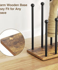 Close-up of 8 Pair Boot Rack And Shoe Organizer Tall Free Standing Stand with wood base and metal frame holding boots