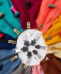 Colorful zippers and spools with Six Pack Universal Instant Fix Zipper Repair Kit Replacement Zip Sliders And Teeth For Jackets