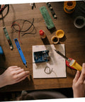 Two Piece Manual Desoldering Pump Solder Removal Tool Suction Gun For PCB Durable Solder Sucker on a workbench