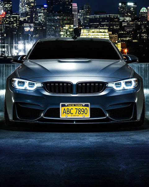 Car showcasing Stainless Steel License Plate Screws Kit with M6x20mm hardware for front mount, in a nighttime city setting.