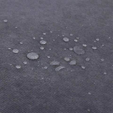 Water droplets on the gray nonwoven fabric cover of Heavy Hitter Portable Closet Wardrobe Organizer.