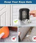Hand using key with Five Key Wall Mounted Lock Box With Waterproof Seal Outdoor Ready Easy To Use Combination Safe.