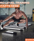 Man performing agility exercise on black gym floor with Thick 0.56 Inch Interlocking Gym Flooring Mats With Rubber Top For Home Gym