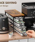Universal Coffee Pod Holder With Two Multifunctional Storage Drawers For Tea Bags And K Cup Pods Nespresso Dolce Gusto CBTL Verismo Holds Up To 60 Pods In A Retro Brushed Bronze Finish shown with kitchen appliances.