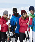 Group of skiers in winter gear including a person wearing a Three Hole Full Face Balaclava Gaiter For Outdoor Sports And Cycling Knit Ski Mask