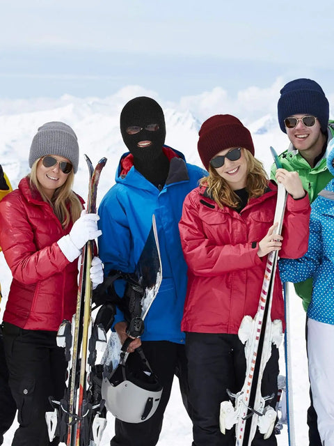 Group of skiers in winter gear including a person wearing a Three Hole Full Face Balaclava Gaiter For Outdoor Sports And Cycling Knit Ski Mask