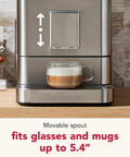 Premium Stainless Steel Fully Automatic Espresso Maker With 15 Signature Drink Recipes Removable Bean Hopper And Easy Touch Controls For Hella Smooth Morning Cup Of Joe with coffee cup under movable spout.