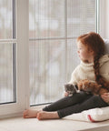 No Sweat DIY Trim To Fit Window Screen For Sliding Doors And Patios And Pet Proof Anti Mosquito Mesh That Keeps Nasty Bugs At Bay and Heavy Duty Polypropylene That Really Holds Up with girl and kittens.